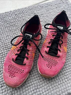 Nike Women Flyknit Sneakers - Pink with Orange Accents and Black Trim ~ size 6.5